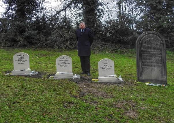 North East Derbyshire District Council leader Martin Thacker with the three new gravestones in of children who died in an accident at Plumbley colliery in 1895.