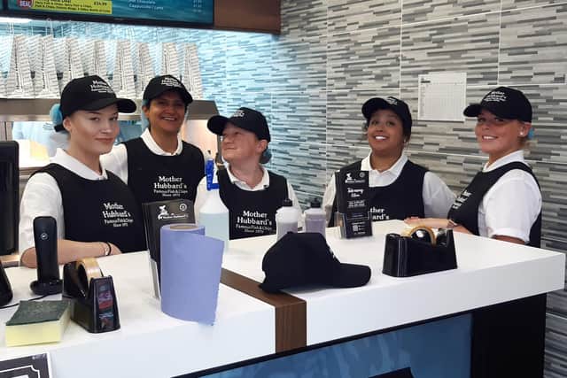 Staff at Sheffield's new Mother Hubbard's fish and chip takeaway and restaurant, on London Road, Sheffield, welcome their first customers during the chippy's opening day with an offer of fish and chips for just 45p.