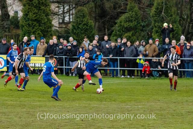 Hallam FC battle it out with Brigg Town in front of a packed crowd. Picture:  focussingonphotograhy.co.uk