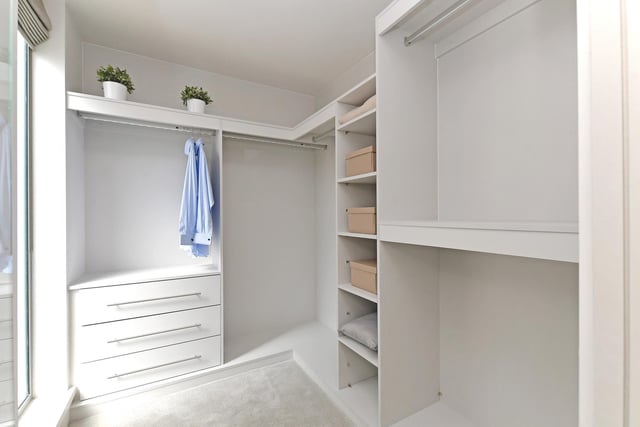 This dressing room offers lots of storage space for a neat and tidy home.