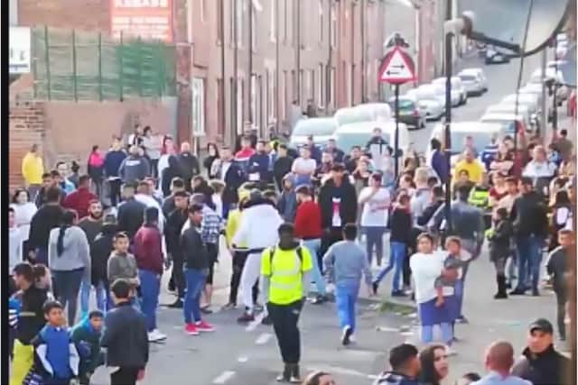 A large crowd gathered on the streets of Page Hall, Sheffield, last month