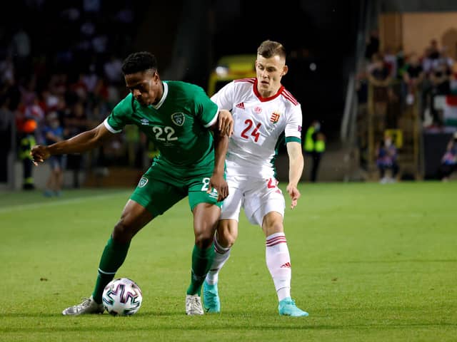 Chiedozie Ogbene of Republic of Ireland is challenged by Szabolcs Schon of Hungary during the international friendly match between Hungary and Republic of Ireland at Szusza Ferenc Stadion on June 08, 2021 in Budapest, Hungary. (Photo by Laszlo Szirtesi/Getty Images)