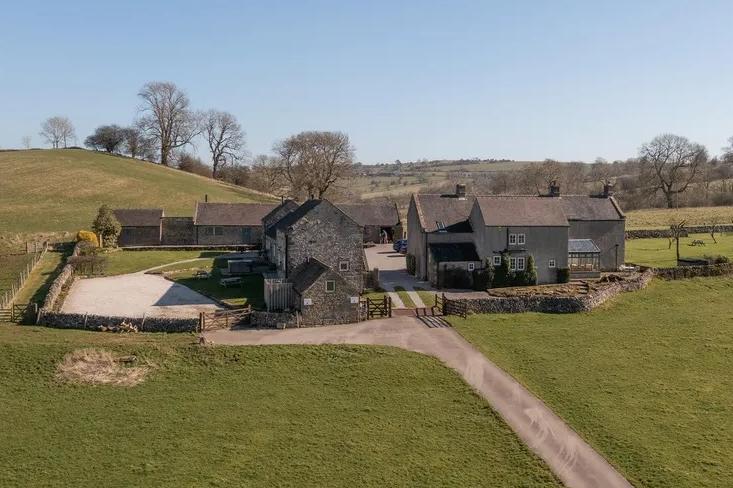 The property comprises a seven-bedroom farmhouse, five-bedroom converted dairy, one-bedroom cottage and three-bedroom converted barn.