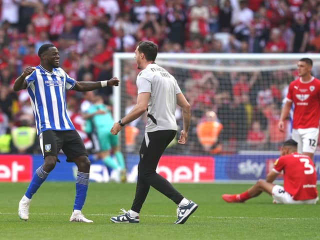 Sheffield Wednesday's Dominic Iorfa (left) celebrates victory and promotion to the Sky Bet Championship as Barnsley's Jonathan Russell and Bobby Thomas (right) look dejected after the Sky Bet League One play-off final at Wembley Stadium, London. Picture date: Monday May 29, 2023. PA Photo. See PA story SOCCER Final. Photo: Nick Potts/PA Wire.