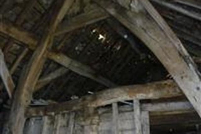 The late 16th century barn is in a very bad condition with multiple slate failures and cracking to gable elevation. Privately owned, the Grade II listed barn forms part of a planning prooposal for conversion of a pub restaurant with the proposal for barns to be converted to garages.