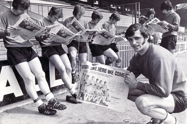 Skipper Eddie Colquhoun and his teammates read about their success in a souvenir edition of The Star at Bramall Lane in May 1971.