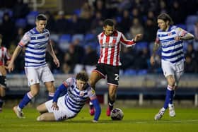 Sheffield United's Iliman Ndiaye (centre) gets away from Reading's Tom Holmes (on ground): Nick Potts/PA Wire.