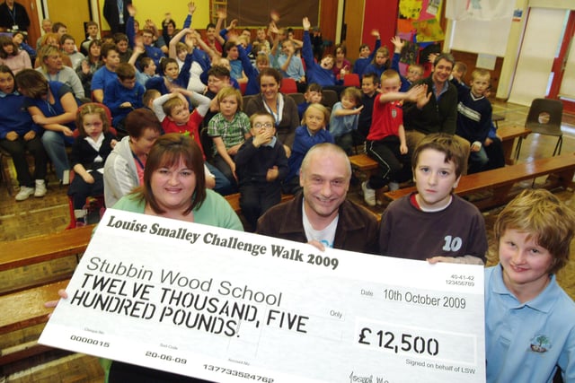 In 2009 the Louise Smalley Challenge Walk held it's annual event where 110 walkers took part in the challenge walk from Millers Dale in The Peak District to Whitwell, a total of 41 1/2 miles. The event raised £12,500 for this years charity, Stubbin Wood Special School in Langwith. Louise's parents Wendy and Trevor Smalley, front left presented the cheque to pupils Kyle Trory 9 and Megan Byrne 13