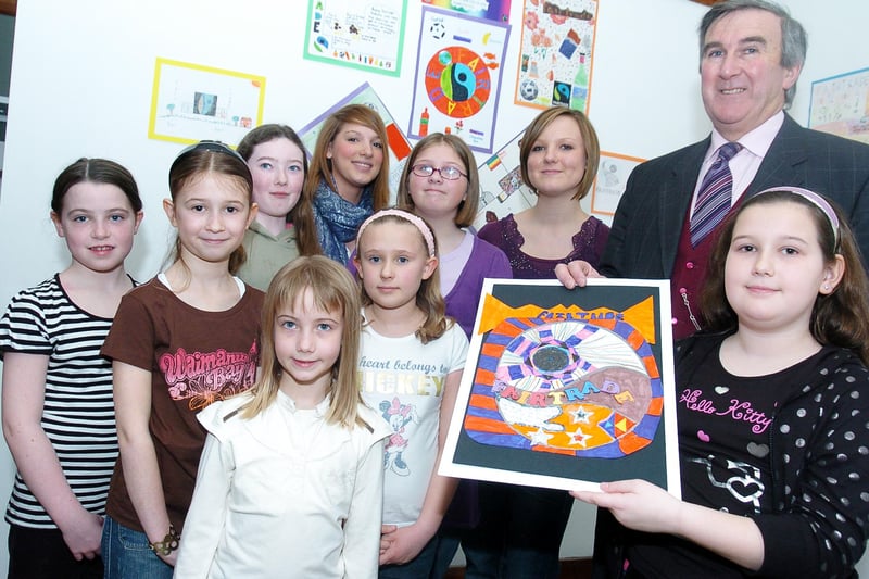 Author Gervase Phinn visited Doncaster Museum to judge the winners of the Fairtrade competition which was run through all the feeder schools for McAuley Schoo in 2008. He is pictured here with entrants back l-r Hannah Duffy, 11, Becki Quigley, 16, McAuley school fairtrade group member, Caitlin Isle, 11 and Kate Stafford, McAuley School Fairtrade group member. Front l-r Jessica McClay, ten, Leah Nesbitt, nine, Ellis Williams, Francesca Patching, ten and overall winner Eleanor Genery, nine of St. Joseph's and St. Teresa's.
