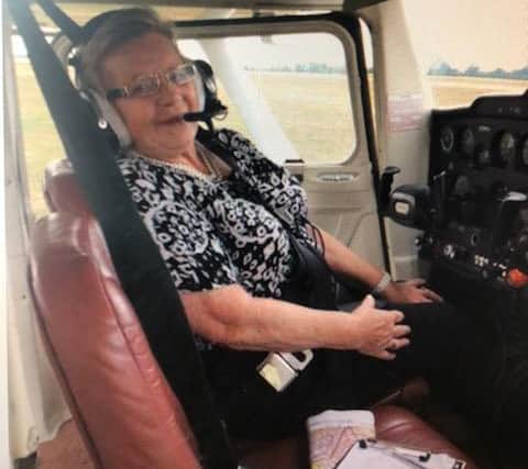An 80-year-old Violet goes on a flying lesson.