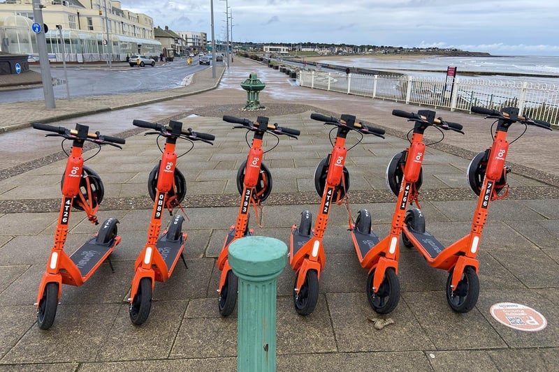 Electric scooters standing in the rain and wind at Seaburn. Picture by FRANK REID.