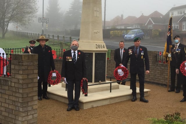 Councillors David Martin, Andy Gascoyne and Vice-Chairman of Ashfield District Council – Arnie Hankin at the War Memorial in Selston with members of the local community including the British Legion. Picture: Ashfield District Council