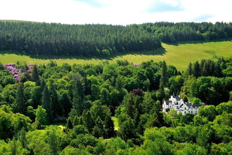 Aerial view of Borthwick Hall showing its woodland setting.