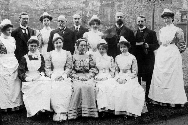 The entire medical and nursing staff in the garden of the old Wood Street Infirmary, circa 1900