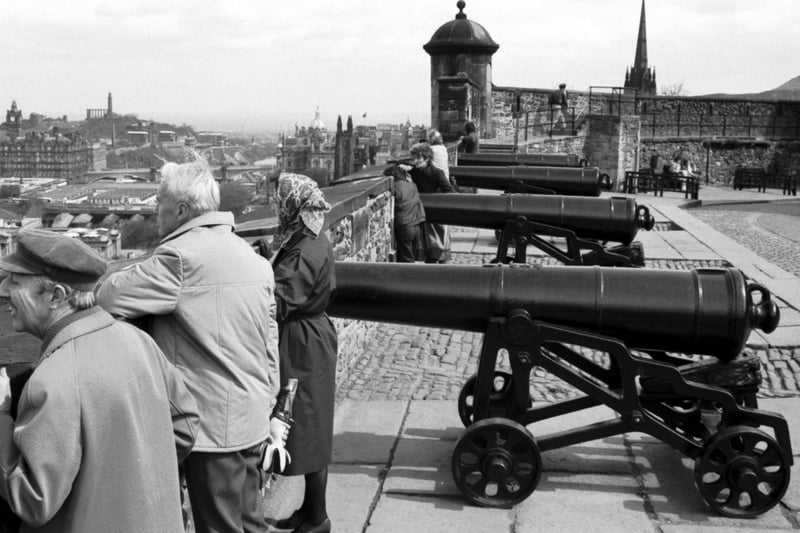 Tourists enjoy the view from the ramparts of Edinburgh Castle in April 1984.