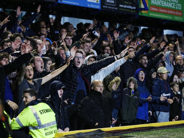 Fans sing during the south-coast derby.