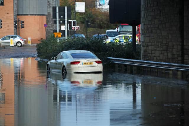 A car sits in floodwater near Meadowhall shopping centre in Sheffield where some people were forced to stay overnight after heavy rain and flooding caused local roads to become gridlocked. Picture date: Friday November 8, 2019. Photo: Danny Lawson/PA Wire