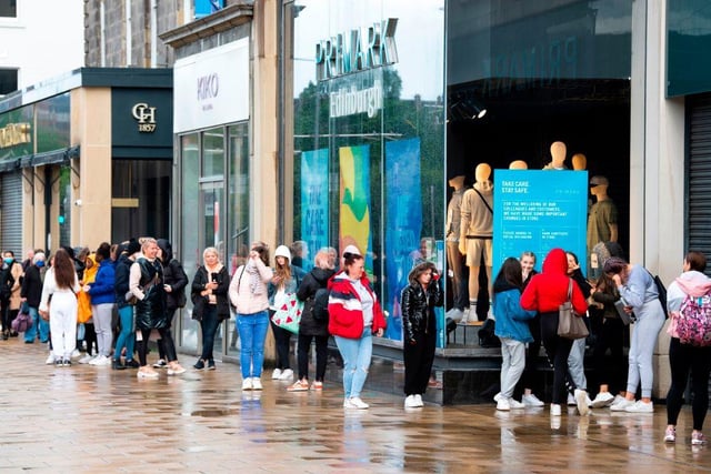 Customers line up outside the Primark store on Princes Street in Edinburgh