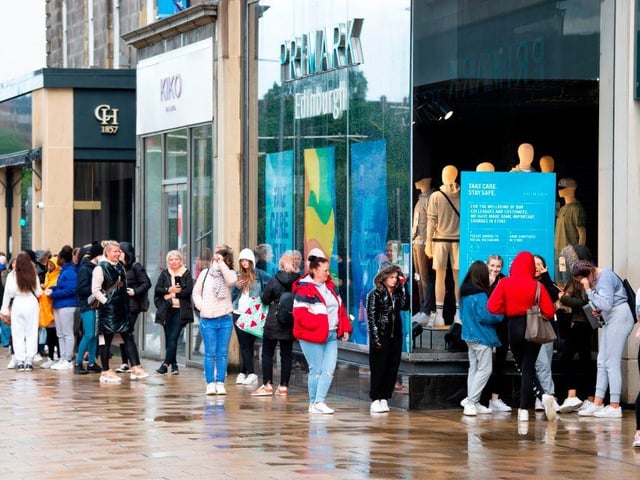 Customers line up outside the Primark store on Princes Street in Edinburgh