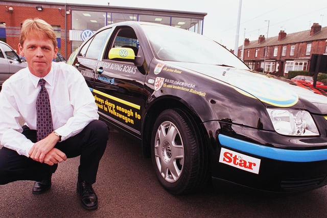 Sales Manager Richard Storey pictured with his car which got him across Europe back in 1999