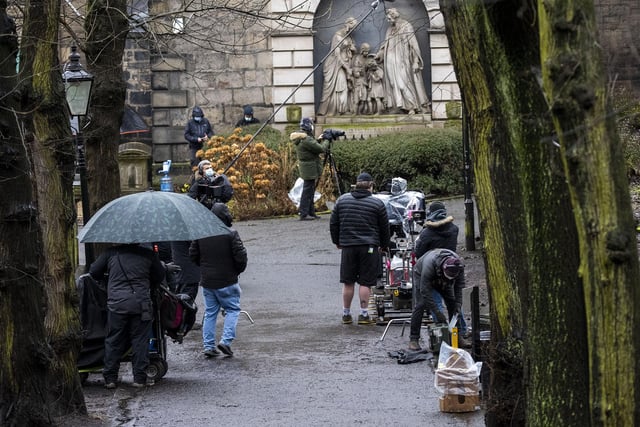 The crew filming in the grounds on The Parish Church of St Cuthbert, Edinburgh on Thursday.