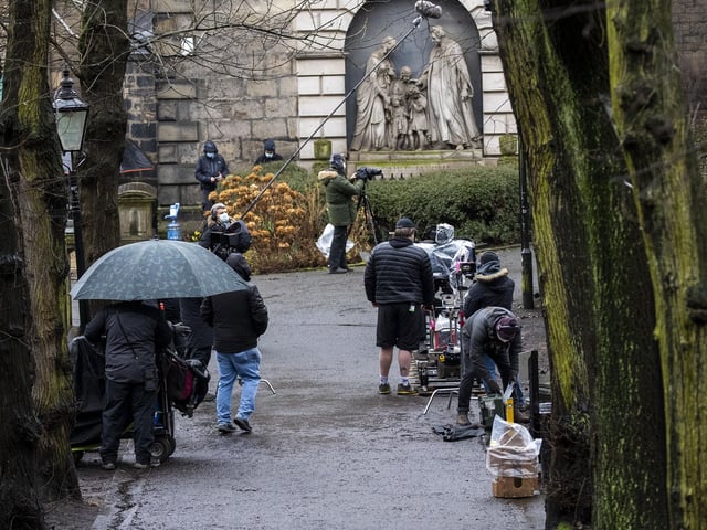 The crew filming in the grounds on The Parish Church of St Cuthbert, Edinburgh on Thursday.