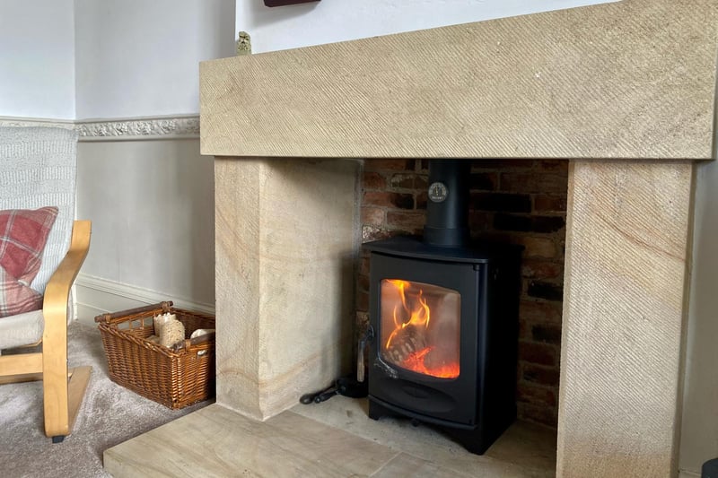 The focal point to the room is the cast-iron wood-burning stove sat on a Stoke Hall Sandstone hearth and surround.