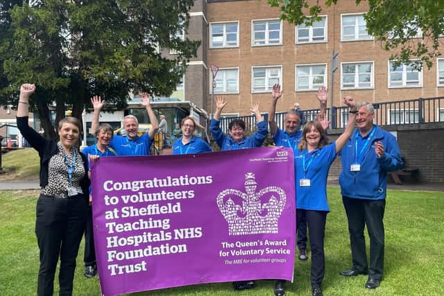 Staff and volunteers at Sheffield Teaching Hospitals celebrate after receiving the Queen's Award for Voluntary Service