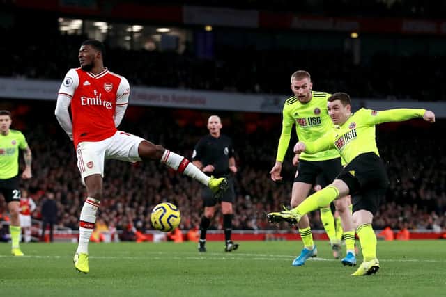 Sheffield United's John Fleck (right) scores his sides goal during the Premier League match agaisnt Arsenal at the Emirates Stadium, London. PA Photo.  Adam Davy/PA Wire.