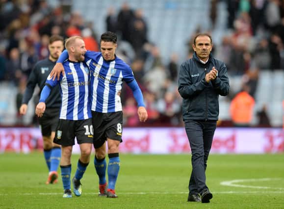 Sheffield Wednesday manager Jos Luhukay with Barry Bannan and Joey Pelupeesy at full time