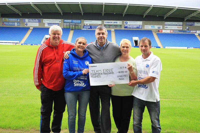 A cheque presentation at the then Proact Stadium from a charity football match held in Ernie's honour.