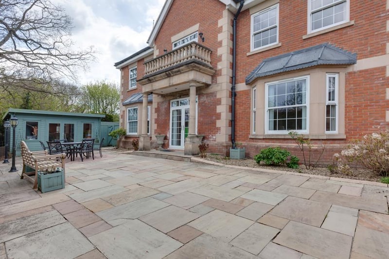 To the rear, there is a large stone flagged seating terrace, which is enclosed by mature hedging and has exterior lighting, external power points, water taps, shrub borders, climbing frame with slide and garden room.