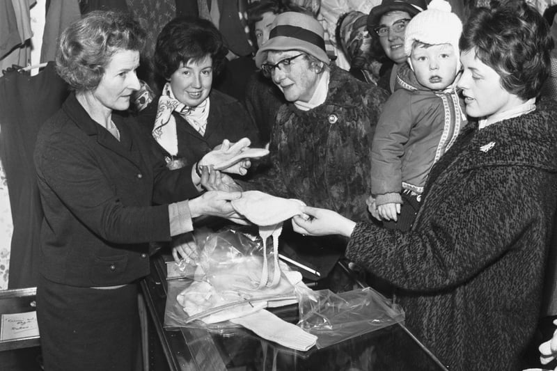 Shoppers enjoy the opening of the new Cum 'n' Bye charity shop on Portobello High Street in March 1966.