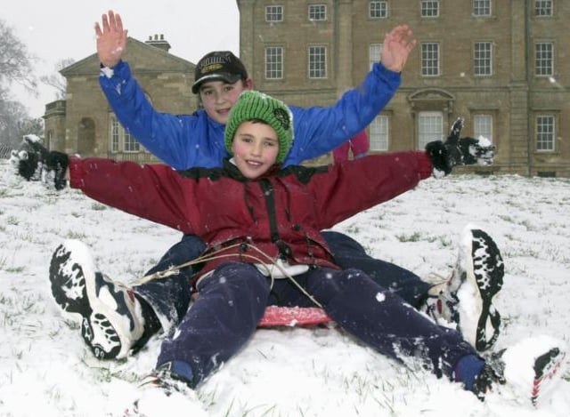 Sprotbrough boys Adam and Tom Kaye, aged ten and 12. Sledging down Cusworth Hall's hill in 2000.