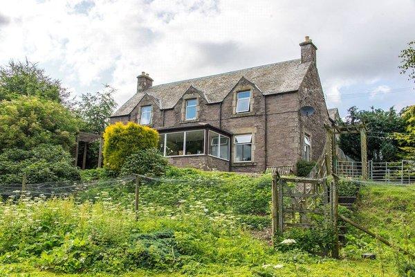 The property includes a five-bedroom traditional stone-built farmhouse