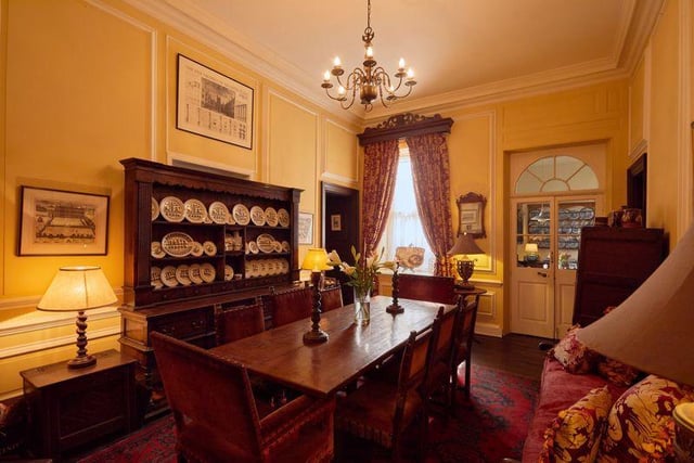 The formal dining room is generous in size, providing plenty of room for entertaining, and is in keeping with the period style of the property, with its coved ceiling, wooden floors and statement chandelier.