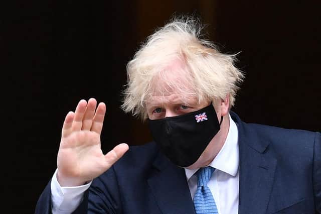 Boris Johnson said he was 'appalled by the abhorrent abuse' directed at England's footballers (Photo by JUSTIN TALLIS/AFP via Getty Images)