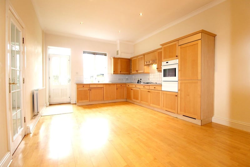 The breakfast kitchen, measuring 5.66m x 3.91m, boasts fitted units and a door to the rear garden.