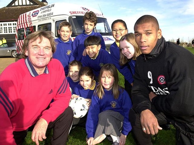 Tony Currie (left) and Marcus Bent, pictured with St. Wilfrid's School pupils at the Sheffield United training ground, for the launch of the Chatfield's sponsorship on November 3, 2000