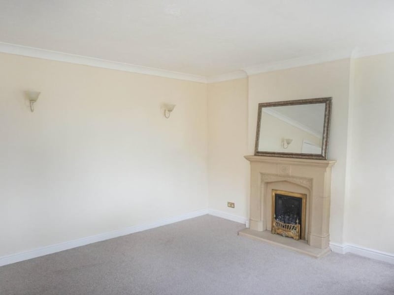 Neutrally decorated front facing lounge with large bay window and side window bringing in lots of natural light, wall lights, tv point, coving and central heating radiator. The marble fireplace with gas fire and mantle and hearth provide the focal point of this lovely room, an ideal space to sit and relax with family and friends and leading into the dining area