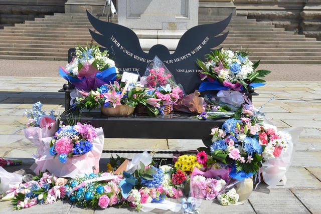 The Chloe and Liam memorial bench outside of South Shields Town Hall was covered in flowers.