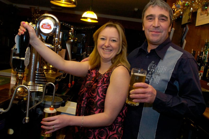 Mark and Jenny Bingham behind the bar at the Miners Arms in Dronfield, when it won The Star readers' Pub of the Year award for second year running in 2010