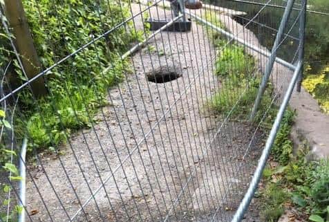 The sinkhole at Rivelin Valley nature trail is still awaiting repairs, despite being fenced off by Sheffield City Council months ago.