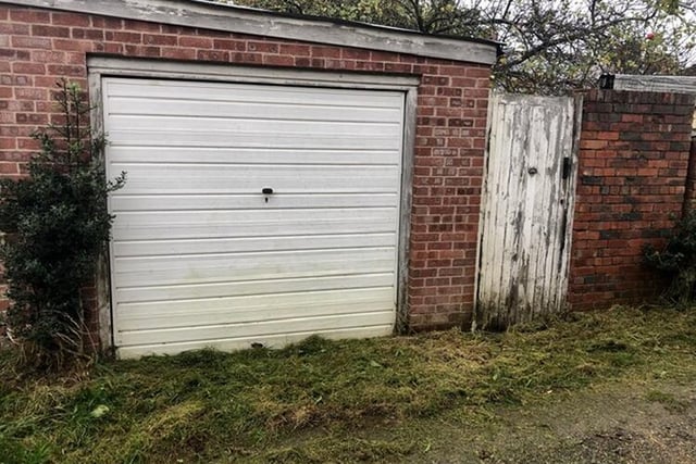 Located to the rear of the garden there is a garage with up and over door and which is accessed from an un-adopted road known as The Lane.