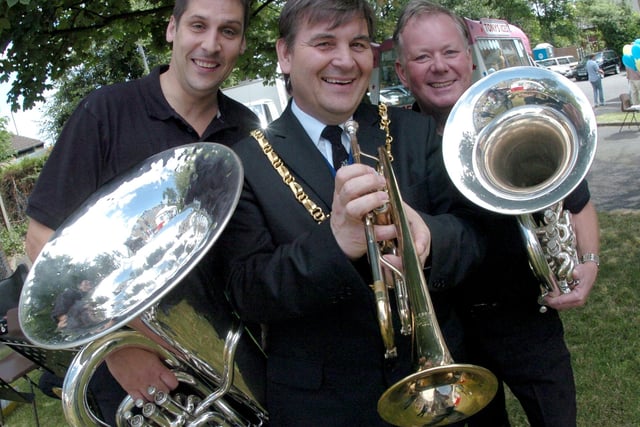 The Lord Mayor Coun Roger Davison got the feel of a trumpet with members of the Brass Players, tuba player Mark Wydell and euphonium player David Moore back in 2005