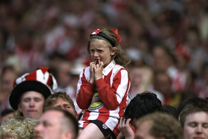 A young Sunderland fan watches the Nationwide League Division One play-off final against Charlton Athletic at Wembley Stadium. The match ended in a 4-4 draw after extra time and Charlton Athletic went on to win 7-6 on penalties.