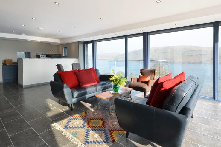 A wall of glass means you can enjoy loch views from the comfort of your sofa.