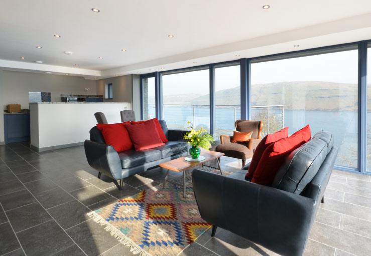 A wall of glass means you can enjoy loch views from the comfort of your sofa.