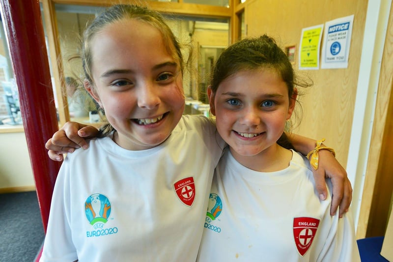Keira Winship, left, and Alica Lawson with their matching England tops at Rossmere Primary School. Picture and caption by FRANK REID