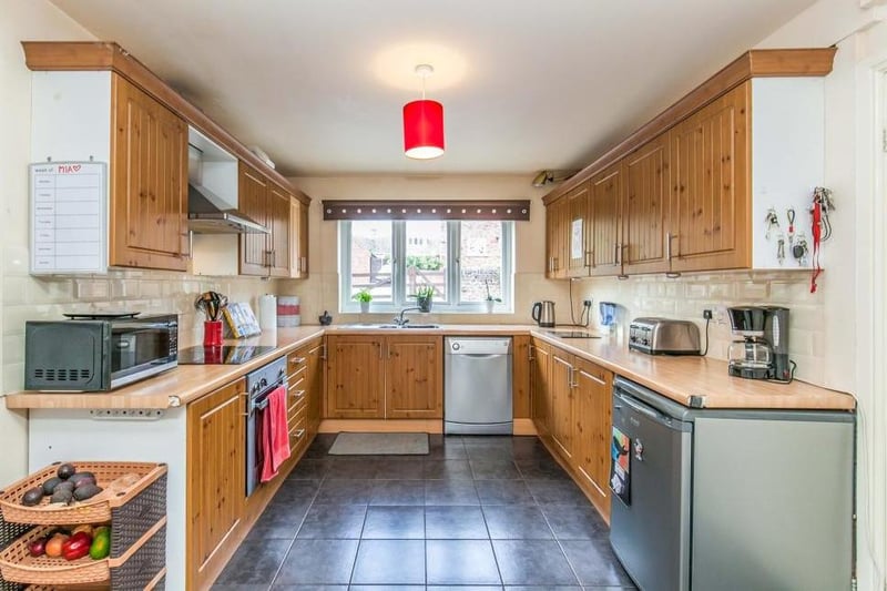 The main kitchen area is of a good size and boasts all the amenities you need, including a range of wood-effect wall and base units, integrated electric oven, stainless-steel sink and ceramic tiled floor. There is also space and plumbing for a dishwasher and an under-counter fridge.